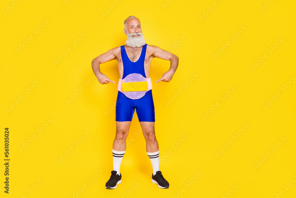 Full length photo of masculine boyfriend successful strong powerlifting master grandfather finger directing belt champion isolated on yellow color background