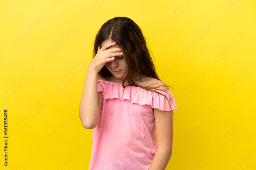 Little caucasian girl isolated on yellow background with headache Little caucasian girl isolated on yellow background with headache