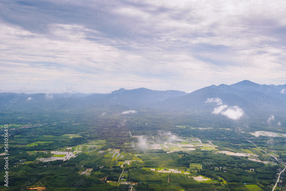 Aerial view of mountain hills and rural valley with white cloud on journey time.