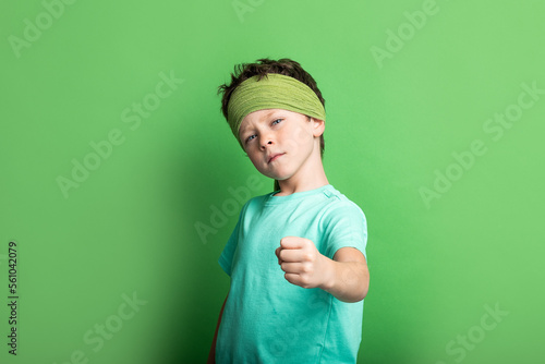 Boy with showing clinched fist photo