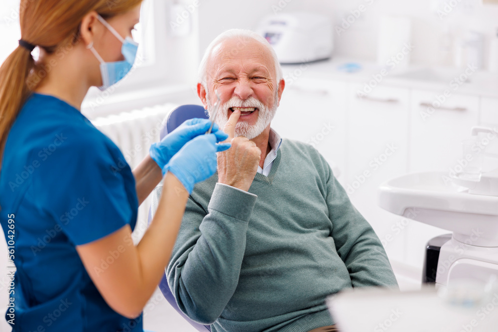 Fototapeta premium Dentist checking up patient