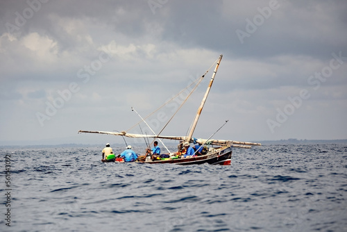 Local fishermen and fishing boats in Lamu island, Kenya