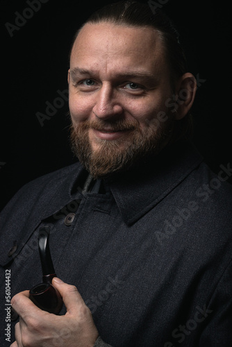 stylish man in retro outfit suit hat smoking wooden pipe sherlock holmes look cosplay england gentleman fashionable confident gangster Guy Ritchie Charlie Hunnam style photo