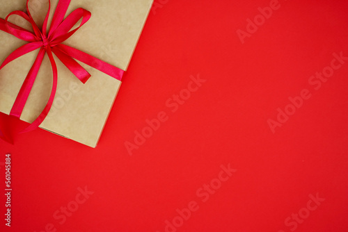on a red background craft gift for Valentine's Day tied with a red bow