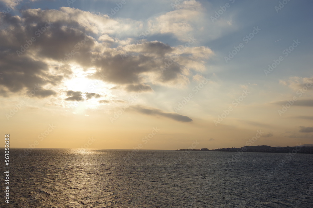 Sun in clouds over the mediterranean sea
