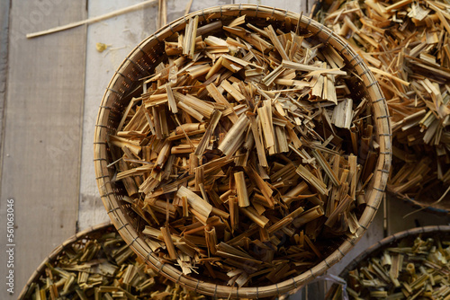 a pile of dried sugar cane leaves