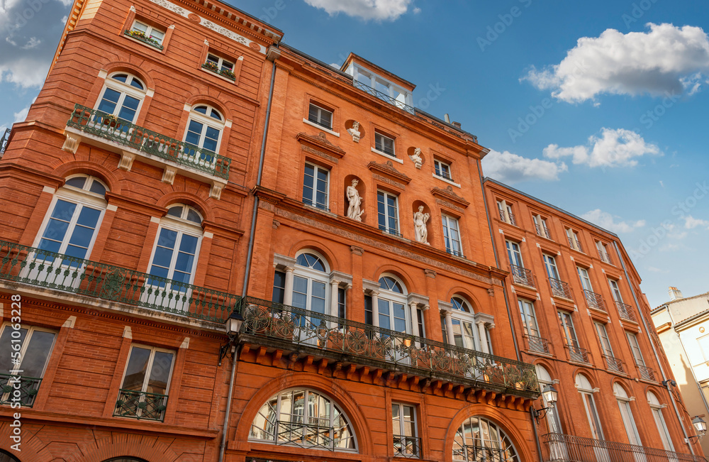 Fototapeta premium Facades of buildings in trinity square in Toulouse, Occitanie, France