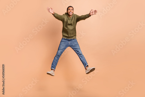 Full length photo of overjoyed positive man wear stylish outfit open hands glad see you good mood isolated on beige color background © deagreez