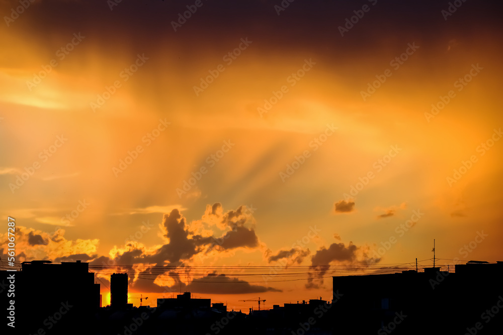 Silhouette of building over sunset in city