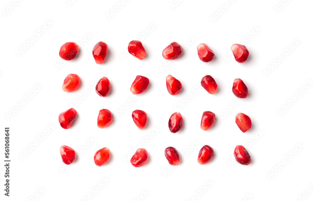 Pomegranate seeds are neatly arranged on a white background top view. Pomegranate seeds are neatly arranged on a white background top view.