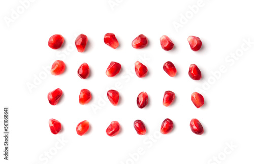 Pomegranate seeds are neatly arranged on a white background top view.