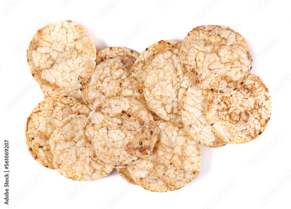 Brown rice crisps, chips pile with chia seeds and quinoa isolated on white, top view Brown rice crisps, chips pile with chia seeds and quinoa isolated on white, top view