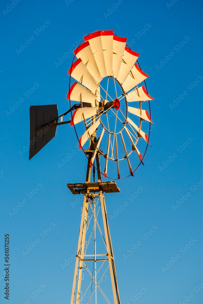 Water Tower and Windmill Against A California Blue Sky Water Tower and Windmill Against A California Blue Sky