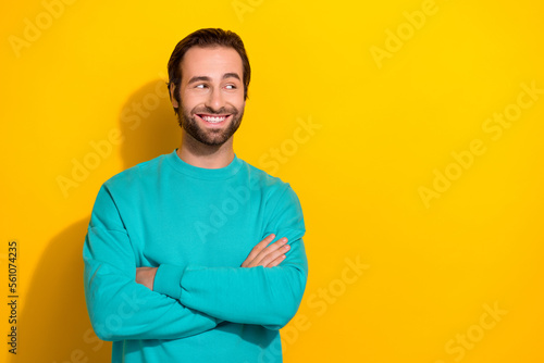 Photo of young successful entrepreneur business company it developer guy crossed hands look empty space currency isolated on yellow color background