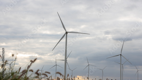 Wind Turbines Windmill Energy Farm. windmill wind turbines in field. Wind turbines power generator electric.	