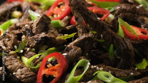 Eating Korean beef Bulgogi BBQ with chopsticks
