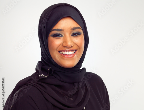 Portrait, islamic and beauty with a woman in studio on a gray background for holy religion or belief in god. Face, skincare and makeup with a muslim female model wearing a traditional hijab