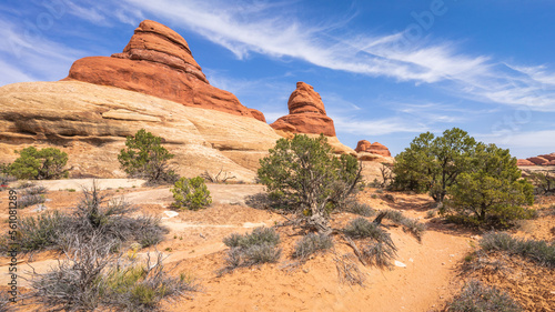 hiking the chesler park loop trail in the needles in canyonlands national park, usa photo