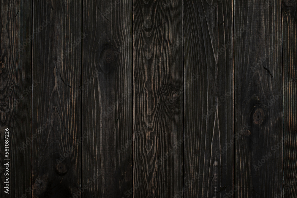 Obraz premium Wooden background made of ebony, persimmon. Dark background with clear wooden structure