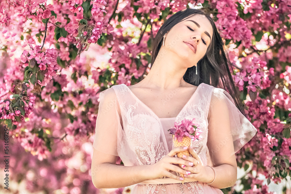Pink flowers garden girl trees mood happiness, tourism in Asia, blooming traditional seasonal background April.waffle cone with flowers Pink flowers garden girl trees mood happiness, tourism in Asia, blooming traditional seasonal background April.waffle cone with flowers