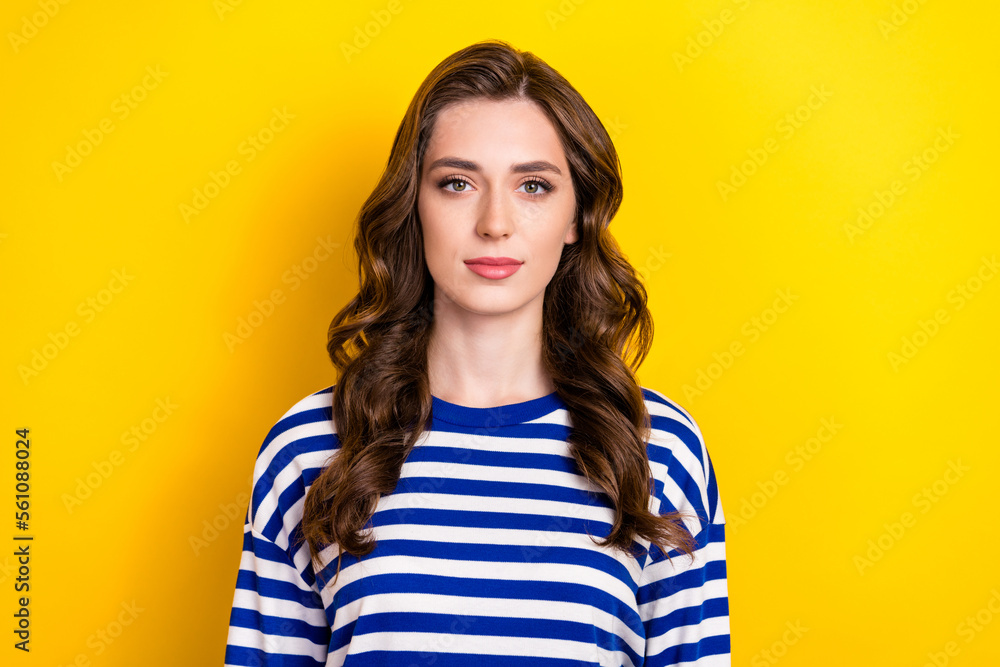Photo of funny cheerful young lady wear striped shirt smiling isolated yellow color background Photo of funny cheerful young lady wear striped shirt smiling isolated yellow color background