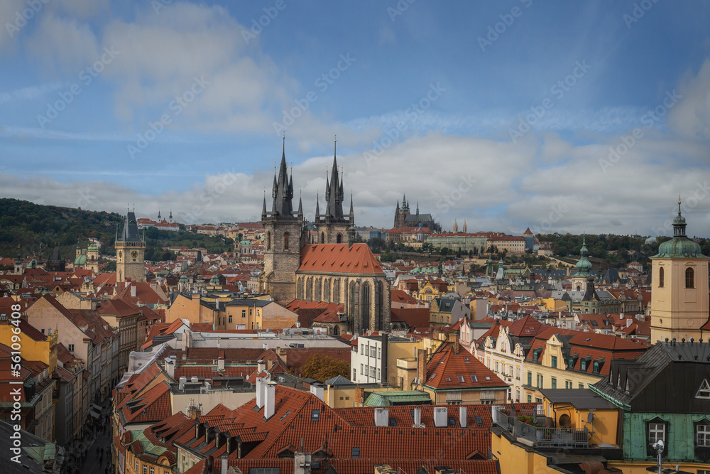 Obraz premium Aerial view of Church of Our Lady before Tyn and Old Town Hall tower with Prague Castle on background - Prague, Czech Republic