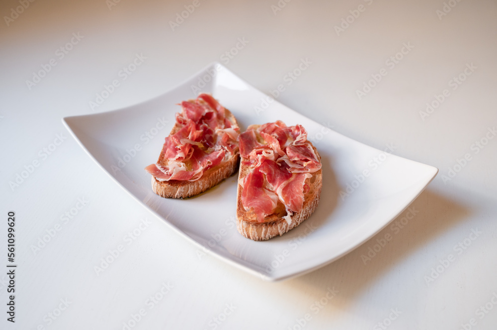 Toast with ham and oil. Traditional breakfast from Spain