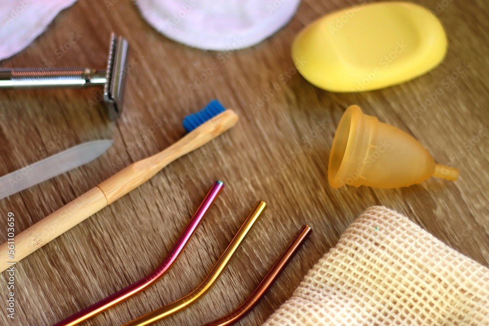 Various zero waste beauty products and kitchen utensils on wooden background. Selective focus. Various zero waste beauty products and kitchen utensils on wooden background. Selective focus.
