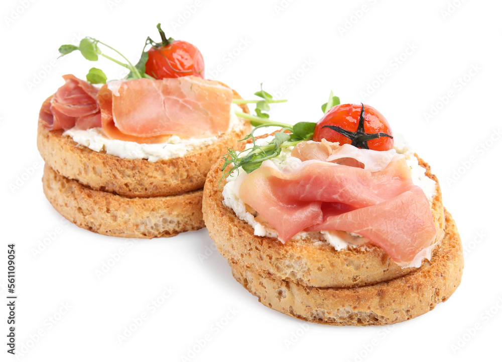 Tasty rusks with prosciutto, cream cheese and tomatoes on white background