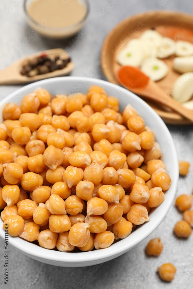 Delicious chickpeas on light grey table, closeup. Hummus ingredient Delicious chickpeas on light grey table, closeup. Hummus ingredient