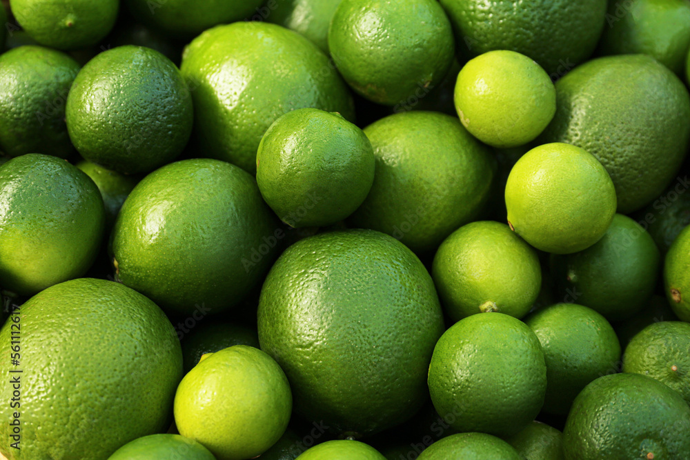 Fresh ripe green limes as background, closeup Fresh ripe green limes as background, closeup