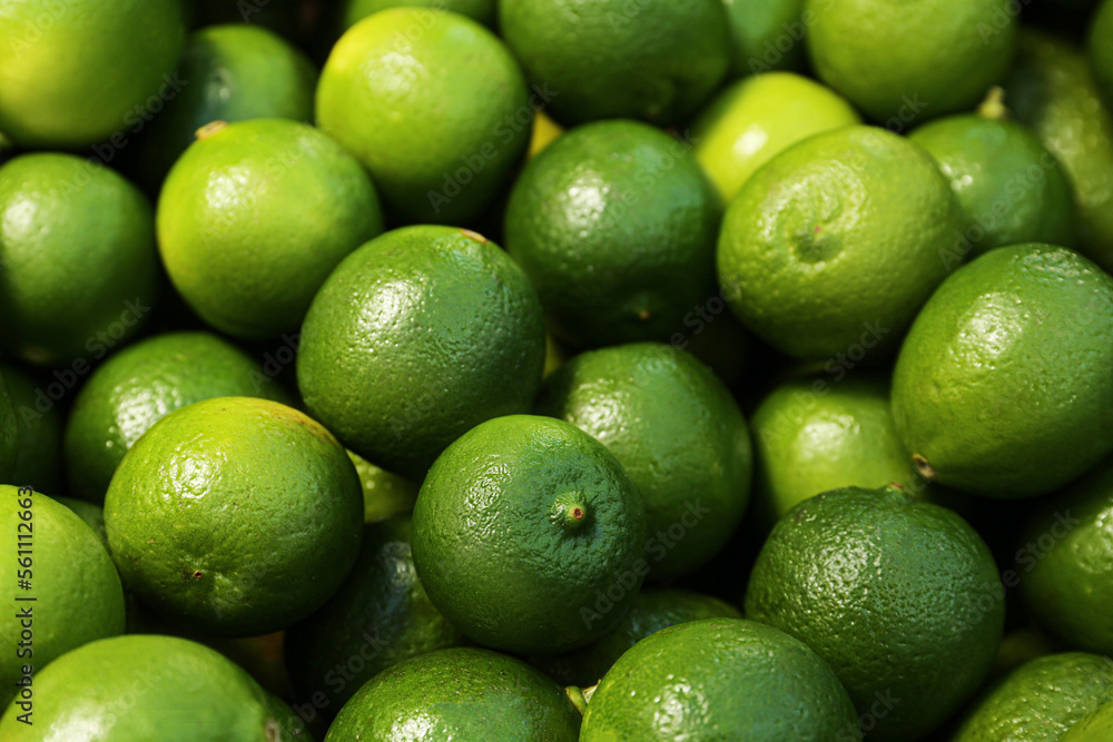 Fresh ripe green limes as background, closeup Fresh ripe green limes as background, closeup