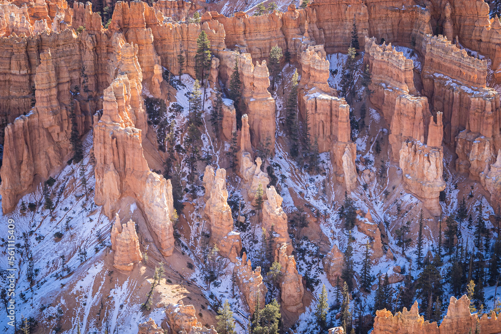 Winter scenery from Bryce Canyon National Park with brilliantly colored orange cliffs and a touch of snow in Utah. Winter scenery from Bryce Canyon National Park with brilliantly colored orange cliffs and a touch of snow in Utah.