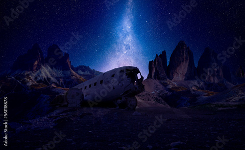 ultra wide start scape with mountains and a plane wreck. astro photography