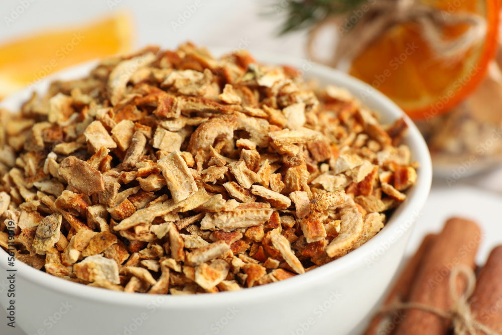 Bowl of dried orange zest seasoning, closeup Bowl of dried orange zest seasoning, closeup