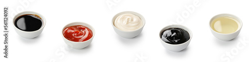 Set, assortment  of sauces in bowls. Ketchup, oyster, teriyaki, soy sauce, mayonnaise, mayo, olive oil isolated on white background with clipping path, cut out.