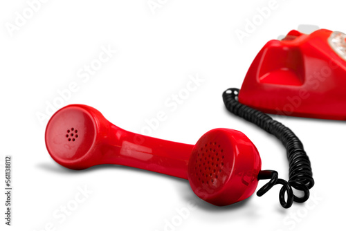 Answering an old fashioned red telephone handset