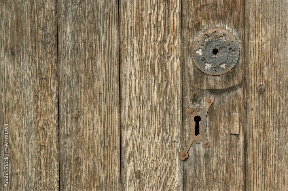 Fragment of an old church door with a keyhole. Fragment of an old church door with a keyhole.