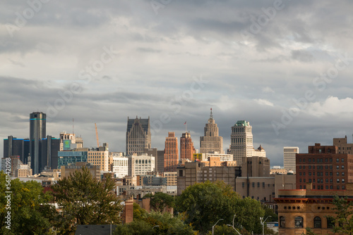 View of landmark downtown Detroit  Michigan skyline as seen from the Cass corridor midtown area. Shot during a sun and clouds mixed afternoon. September 2022.