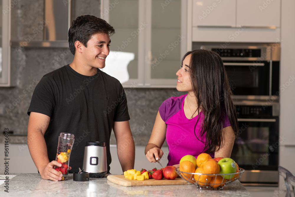 Couple preparing a smoothie