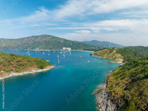 Aerial View Amazing sea with travel boats,sailing boats in the sea,Beautiful sea in summer season at Phuket island Thailand, Travel boats,Ocean during summer with many resting people © panya99