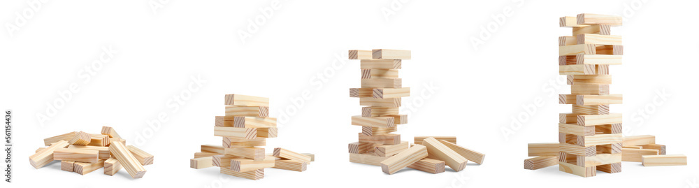 Playing Jenga. Wooden blocks and constructions on white background Playing Jenga. Wooden blocks and constructions on white background