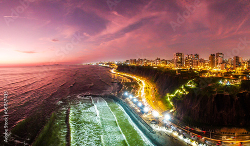 Costa Verde of Lima after sunset shot by drone panorama (Miraflores by night) photo