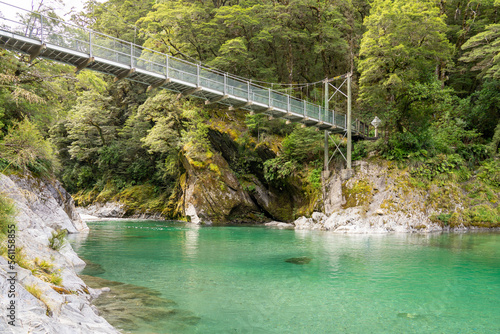 Swinging Bridge over the Blue Pools and the Makarora River, Haast Pass, West Coast, South island, New Zealand photo