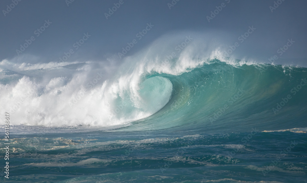Big breaking Ocean wave on a sandy beach on the north shore of Oahu Hawaii Big breaking Ocean wave on a sandy beach on the north shore of Oahu Hawaii
