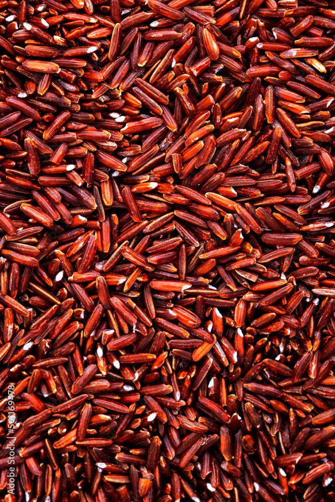 Wild raw red rice groats, food background texture, top view Wild raw red rice groats, food background texture, top view