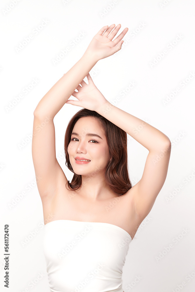 Beautiful Young Asian woman lifting hands up to show off clean and hygienic armpits or underarms on white background, Smooth armpit cleanliness and protection concept Beautiful Young Asian woman lifting hands up to show off clean and hygienic armpits or underarms on white background, Smooth armpit cleanliness and protection concept