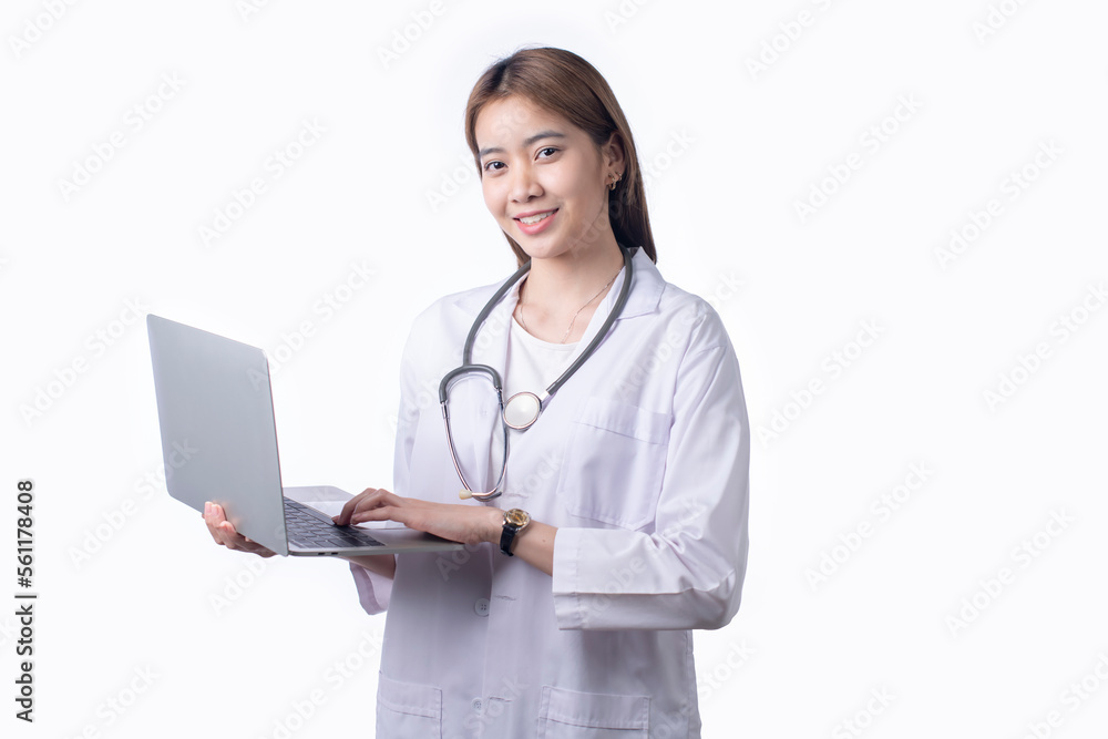 Portrait of Asian woman doctor wearing uniform holding laptop stand isolated on white background. Female medical nurse or practitioner with stethoscope look at camera. Portrait of Asian woman doctor wearing uniform holding laptop stand isolated on white background. Female medical nurse or practitioner with stethoscope look at camera.