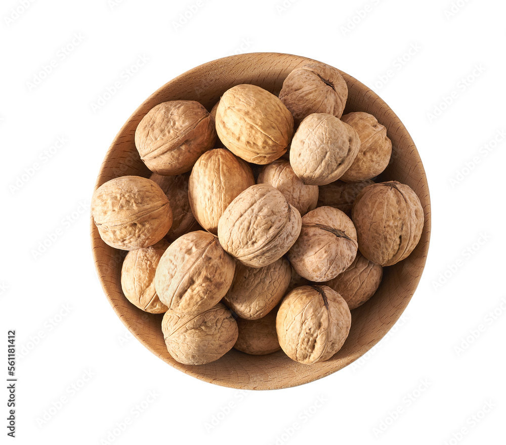 Walnuts in wooden bowl isolated on white background, top view. Walnuts in wooden bowl isolated on white background, top view.