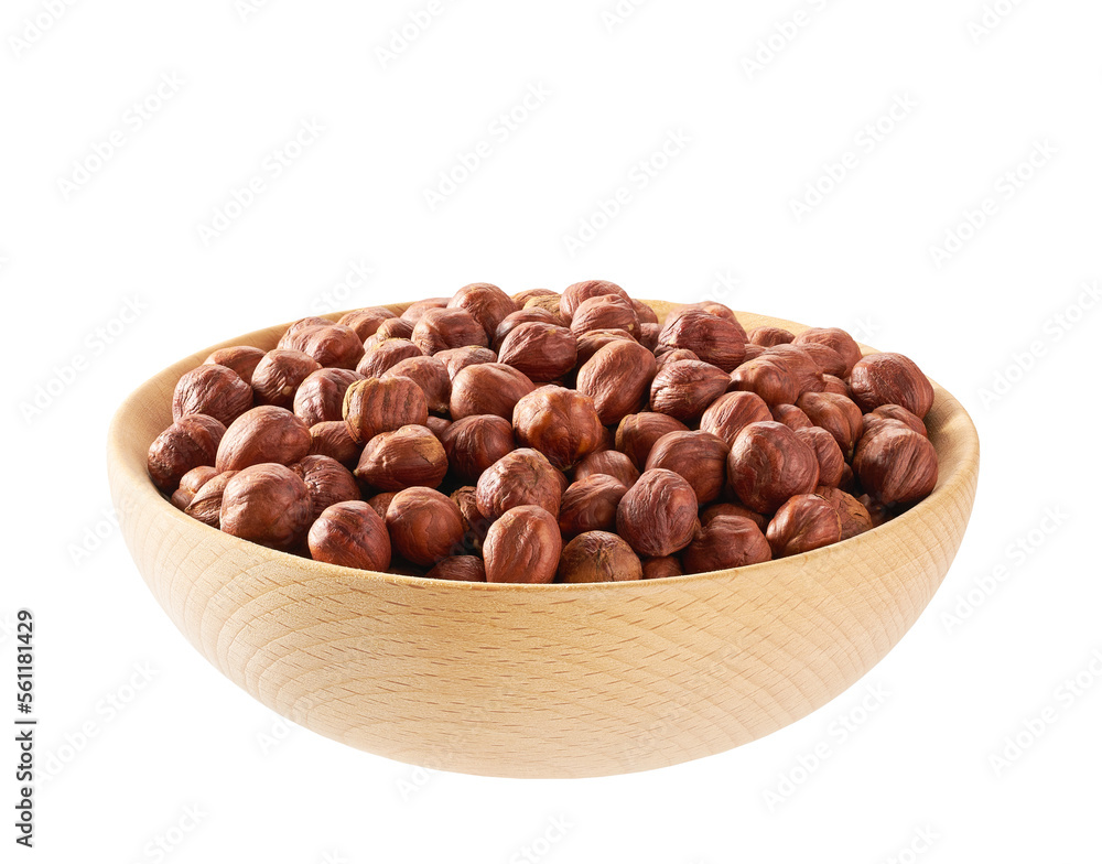 Peeled hazelnuts in a wooden bowl isolated on white.Front view. Peeled hazelnuts in a wooden bowl isolated on white.Front view.